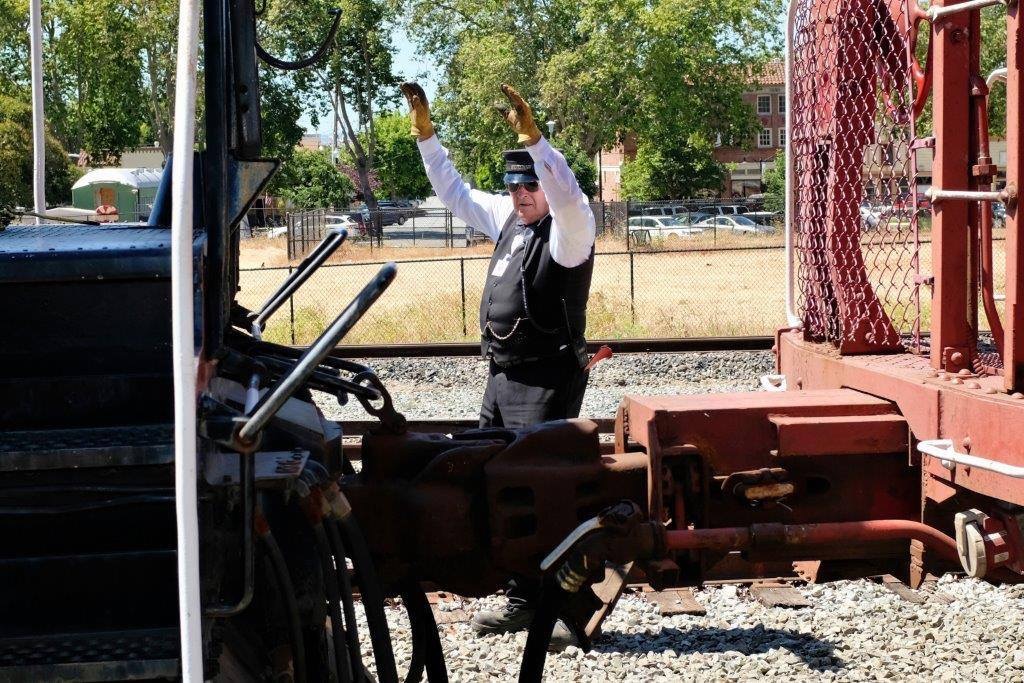 Brakeman coupling caboose to locomotive in Niles.jpg
