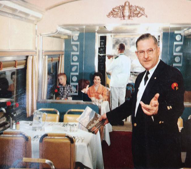 Steward with banquette behind glass partition.jpg